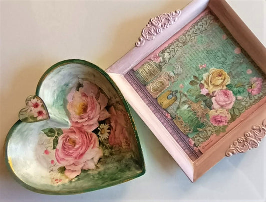 Decorative heart-shaped and square trays with floral design on a light background