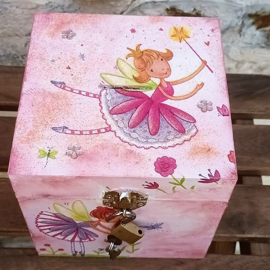 Soft pink hand crafted money box with fairy design, lock and keys