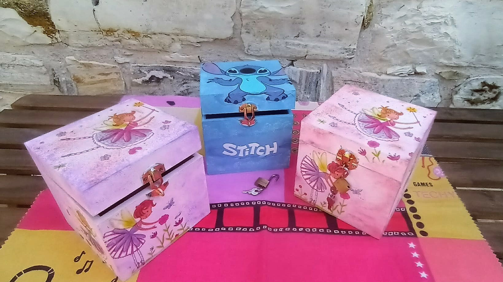 Three colorful children's wooden money boxes handcrafted with lock and keys  