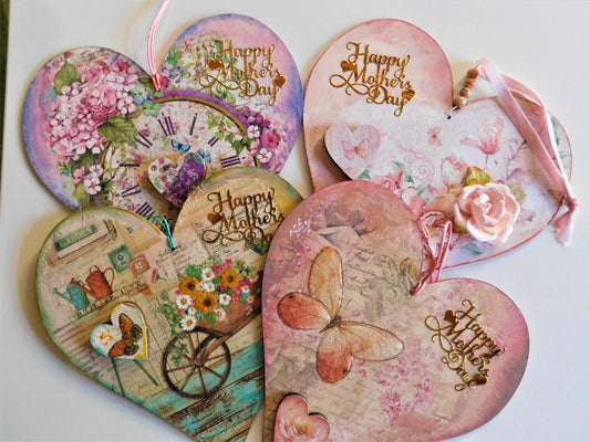 Heart-shaped Mother's Day cards with floral, butterfly, and vintage cart designs.