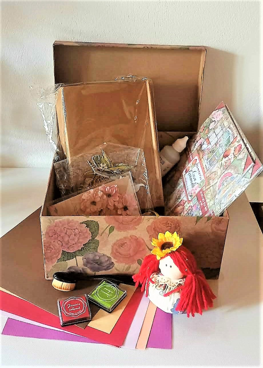 Complete scrapbooking set of materials in a nice floral carton box 
