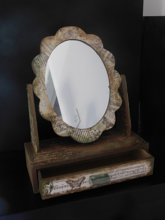 Mirror with a drawer